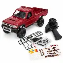 Camioneta RC Toyota roja y accesorios.webp